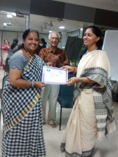 Mrs. Lakshmi Prabha giving away the certificates to the trainees.