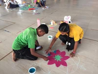 children at work during kolam competition